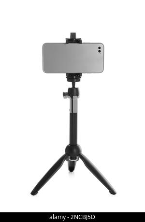 Smartphone fixed to tripod on white background Stock Photo