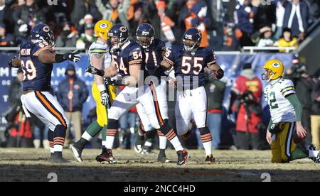 Chicago Bears' Brian Urlacher (54) holds up the NFC Championship Trophy  after the Bears beat the New Orleans Saints 39-14 in the NFC Championship  game at Soldier Field in Chicago on January