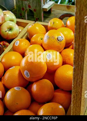 Farm fresh oranges on display for sale in a rural Alabama farmer's market or roadside market in Pike Road Alabama, USA. Stock Photo