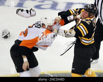 Boston Bruins left wing Shawn Thornton (22) and Philadelphia Flyers left  wing Daniel Carcillo (13) square off in the first period of the 2010  Bridgestone NHL Winter Classic at Fenway Park in