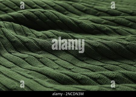 Dark green knitted wool texture as background, closeup Stock Photo