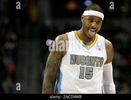 Denver Nuggets' Carmelo Anthony is fouled by Los Angeles Clippers' Shaun  Livingston in Game 5 of the NBA Western Conference first-round playoff  series in Los Angeles on May 1, 2006. The Clippers