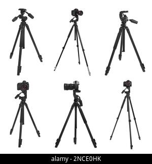 Set of modern tripods with professional cameras on white background Stock Photo