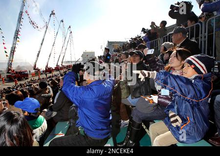 Nine year old Yu Yamazaki right his mother Eriko and other