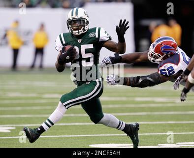 New York Jets running back Joe McKnight (25) fumbles the ball on a