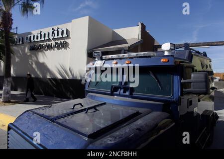 https://l450v.alamy.com/450v/2ncfbhh/hold-f0r-photo-editor-susan-plageman-in-this-photo-taken-on-dec-14-2010-a-mexican-federal-police-armored-vehicle-is-parked-near-the-don-quintin-bar-in-ciudad-juarez-mexico-the-owner-of-don-quintin-closed-the-juarez-location-and-re-opened-in-el-paso-many-mexicans-have-moved-not-only-their-families-but-entire-businesses-out-of-the-country-due-to-the-violence-ap-photodario-lopez-mills-2ncfbhh.jpg