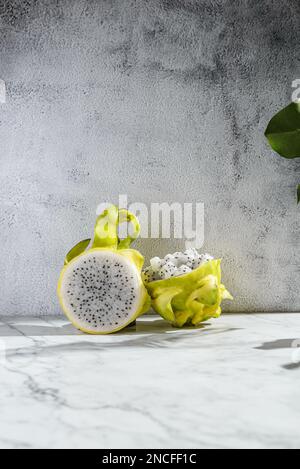 yellow pitahaya on a gray background. High quality photo Stock Photo