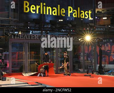 Berlin, Germany. 14th Feb, 2023. Workers install red carpets in front of Berlinale Palast in Berlin, Germany, Feb. 14, 2023. The 73rd Berlin International Film Festival will be held from Feb. 16 to 26. Credit: Ren Pengfei/Xinhua/Alamy Live News Stock Photo