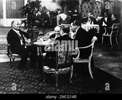 Italian Prime Minster Benito Mussolini, German Chancellor Dr. Heinrich Bruening, German Foreign Minister Dr. Julius Curtius and Italian Foreign Minister Dino Grandi seated around a small table on August 11, 1931 in Rome, Italy. (AP Photo)