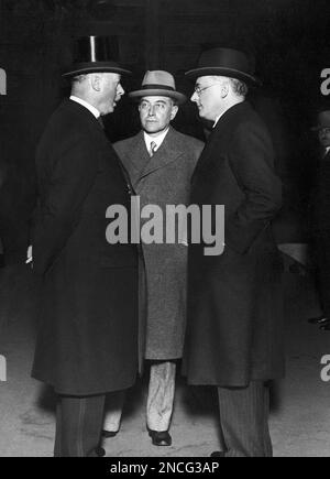 German Chancellor Dr. Heinrich Bruening, right, and Foreign Minister of Germany, Dr. Julius Curtius, center, talk with British Ambassador to Germany Sir Horace Rumboldt, prior to their trip to Chequers, United Kingdom, on June 3, 1931 from Berlin, Germany. (AP Photo)