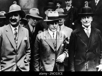 German Chancellor Dr. Heinrich Bruening, right, and Foreign Minister of Germany, Dr. Julius Curtius, center, leave the Foreign Office in London, United Kingdom, on July 22, 1931 after a hearty breakfast. (AP Photo)
