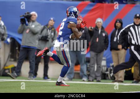 New York Giants Mario Manningham (82) comes down with an Eli Manning pass  in the fourth quarter as San Francisco 49ers Tramaine (26) defends in the NFC  Championship at Candlestick Park in