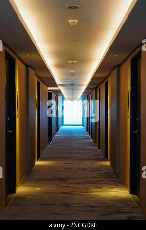 Empty hotel corridor in warm color tone Stock Photo
