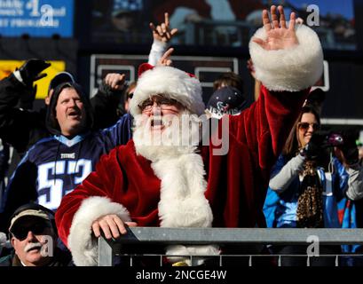 A Tennessee Titans fan is dressed as Santa as he watches the Titans play  the San Diego Chargers in the second quarter of an NFL football game on  Friday, Dec. 25, 2009