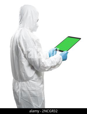 Worker wears medical protective suit or white coverall suit with blank screen tablet isolated on white background Stock Photo