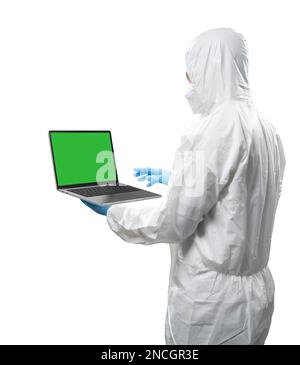 Worker wears medical protective suit or white coverall suit with blank screen laptop isolated on white background Stock Photo