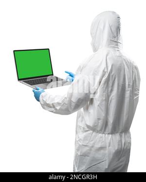Worker wears medical protective suit or white coverall suit with blank screen laptop isolated on white background Stock Photo