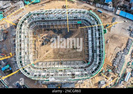 MINSK, BELARUS - 13 NOVEMBER, 2022: Construction of new football stadium. Aerial top view of construction equipment, cranes, heavy machinery and build Stock Photo