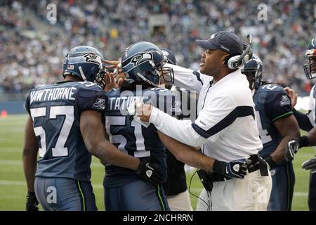 Carolina Panthers linebackers coach Ken Flajole gives instructions to  rookie Jon Beason during Beason's first practice at training camp in  Spartanburg, South Carolina, Monday, August 6, 2007. (Photo by David T.  Foster