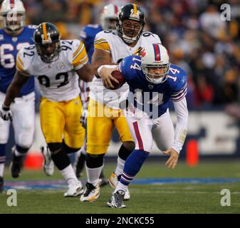 Pittsburgh Steelers defenders James Harrison (92) and Aaron Smith pressure  Baltimore Ravens quarterback Steve McNair during