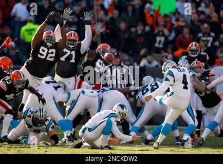 Carolina Panthers place kicker John Kasay, center, is consloed by teammates  punter Jason Baker, left, and guard Mackenzy Bernadeau (73), right, ater  missing a field goal that would have won the game