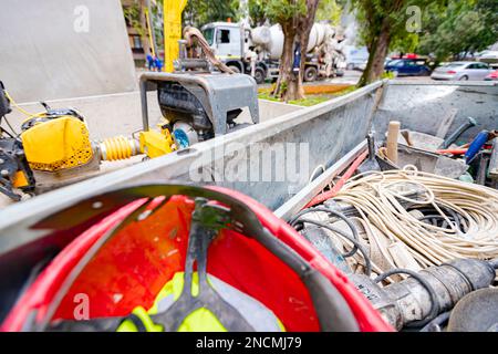 Steel crate, container, toolbox overfull of many different tools were placed in the truck trailer on the construction site. Stock Photo