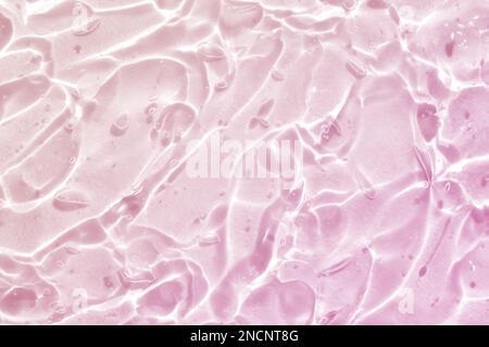 pink water wave abstract, pure natural ripple and bubble texture, gel soap, background photography Stock Photo