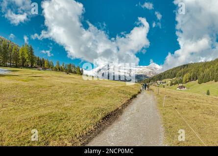 A famely takes a walk in the Dischma valley Stock Photo