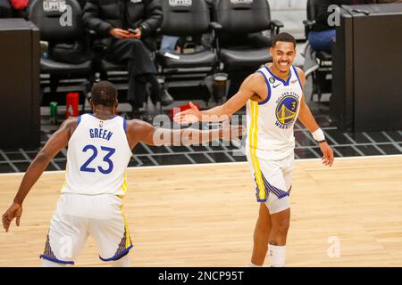 Los Angeles, United States. 14th Feb, 2023. Golden State Warriors guard Jordan Poole (R) greets with forward Draymond Green (L) during an NBA game against the Los Angeles Clippers. Final score: Clippers 134:124 Warriors Credit: SOPA Images Limited/Alamy Live News Stock Photo