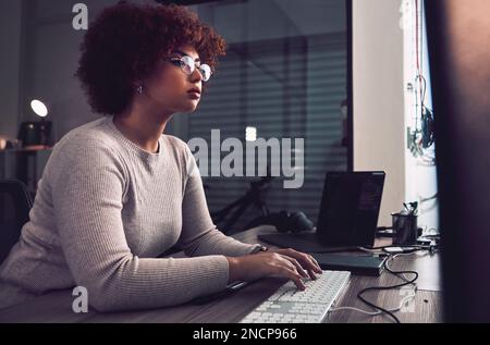 Night, computer typing and black woman programmer, software developer and cybersecurity internship. Coding, programming and USA person or developer Stock Photo