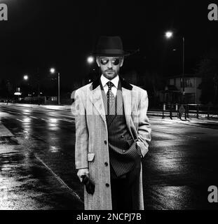 Black and white portrait of elegant man in the night Stock Photo