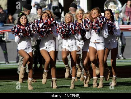 The Sea Gals cheerleades wear combat boots in honor of veterns before the  Seattle Seahawks against the New York Giants NFL football game, Sunday,  Nov. 7, 2010, in Seattle. (AP Photo/Ted S.