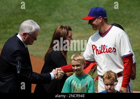 Philadelphia Phillies pitcher Roy Halladay, accompanied by his wife Brandy  and two sons, is honored during a ceremony for his perfect game against the  Florida Marlins in May, before the Phillies' baseball