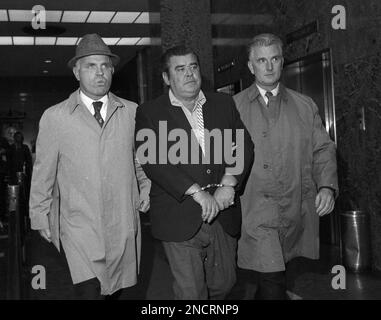 Carmine Tramunti, center, is shown in custody, leaving FBI headquarters