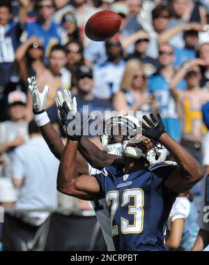 San Diego Chargers' Quentin Jammer intercepts a pass intended for Seattle  Seahawks' Mike Williams (17) as Chargers' Eric Weddle looks on in the first  half of an NFL football game, Sunday, Sept.