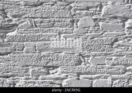 Old stone wall painted white Stock Photo