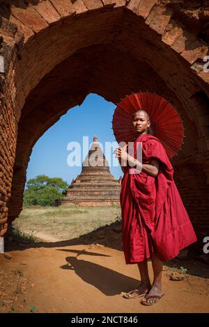 A buddhist Monk in a pagoda in Bagan Myanmar Stock Photo