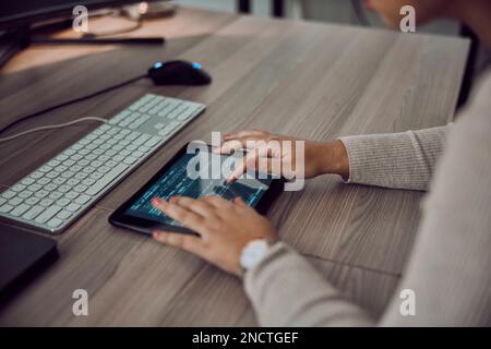 Tablet, hands and programmer screen for coding or programming on desk in office. Information technology, female developer and woman with digital Stock Photo