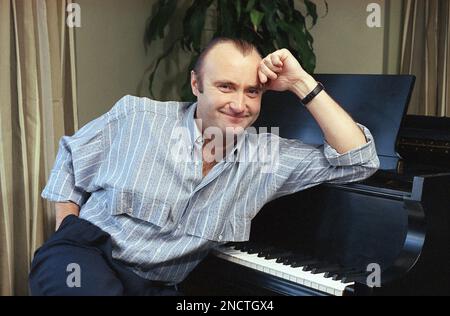 Rock superstar Phil Collins shown at the piano during an