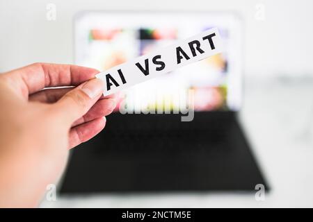 AI vs Art  text in front of laptop bokeh with out of focus images, concept of Artificial Intelligence creating generative content based on art made by Stock Photo