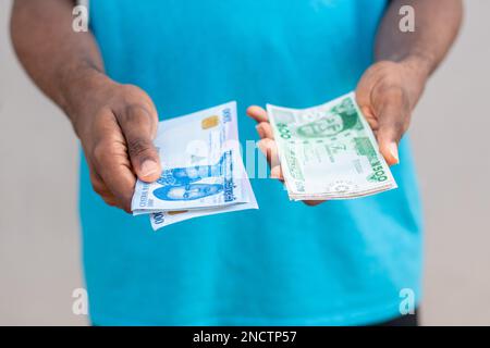 person holding the new nigerian naira notes Stock Photo