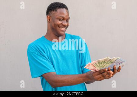 person holding the new nigerian naira notes Stock Photo