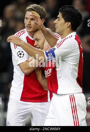 Luis Suarez of Ajax, right, celebrates his goal with teammate Mounir El  Hamdaoui against AJ Auxerre during the first round group G Champions League  soccer match at the Arena stadium in Amsterdam,