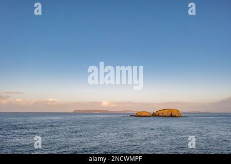 Aerial view of Sheep Island with Rathlin Island in the background , County. Antrim, Northern Ireland, UK. Stock Photo