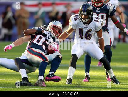 Baltimore Ravens cornerback Cary Williams, right, knocks the ball away from Seattle  Seahawks wide receiver Sidney Rice during the fourth quarter against the Baltimore  Ravens at CenturyLink Field in Seattle, Washington on