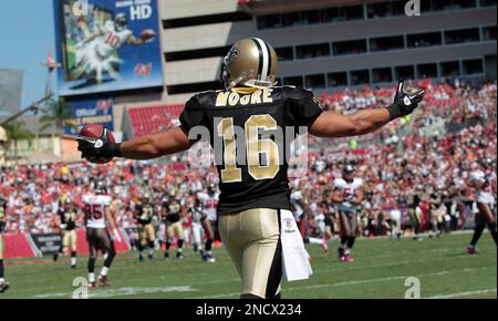 New Orleans Saints receiver Lance Moore (16) takes a short Drew Brees pass  up the field for 19-yards during second quarter action against the Oakland  Raiders at the Louisiana Superdome in New