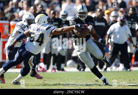 Oakland Raiders running back Michael Bush stretches during pre-game warm  ups at Invesco Field at Mile High on October 24, 2010 in Denver. UPI/Gary  C. Caskey Stock Photo - Alamy