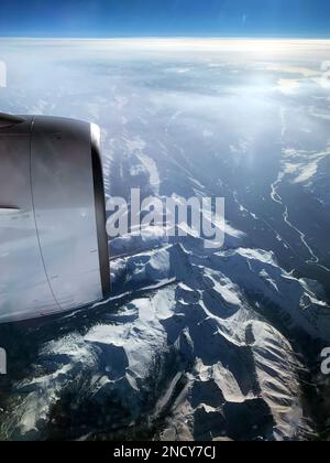 Aerial view of an aircraft engine flying over Canadian Rocky Mountains, Canada Stock Photo