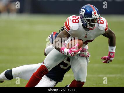 New York Giants' Hakeem Nicks (88) is stopped by Houston Texans' Glover  Quin in the fourth quarter of an NFL football game Sunday, Oct. 10, 2010,  in Houston. (AP Photo/Eric Gay Stock