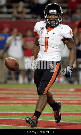 Oregon State's Jacquizz Rodgers (1) scores against Oregon's Spencer  Paysinger (35) during the first half of an NCAA college football game in  Eugene, Ore., Thursday Dec. 3, 2009. Oregon beat Oregon State